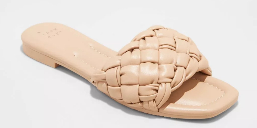 Solid tan slide sandal with a braided strap