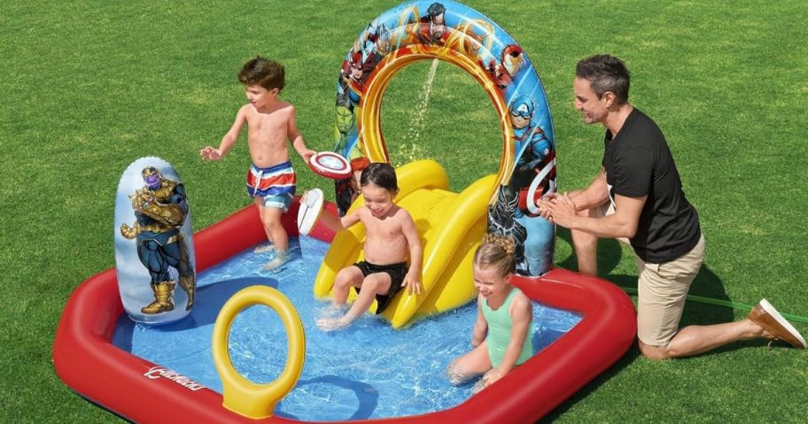 Kids playing in a Bestway Marvel's Avengers Assemble Kids Inflatable Water Play Center