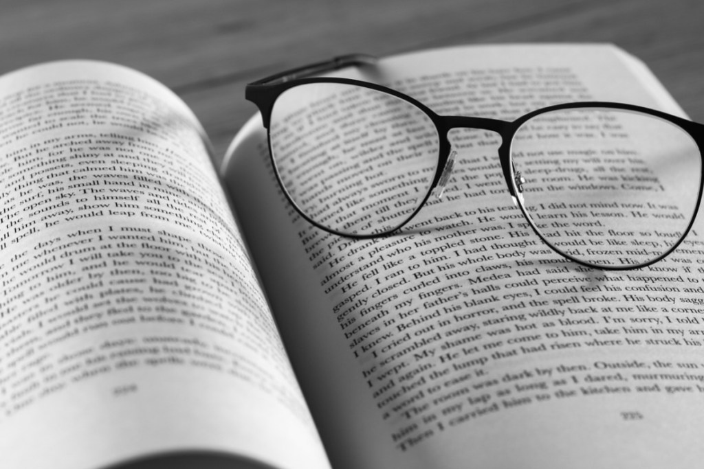 A book and glasses