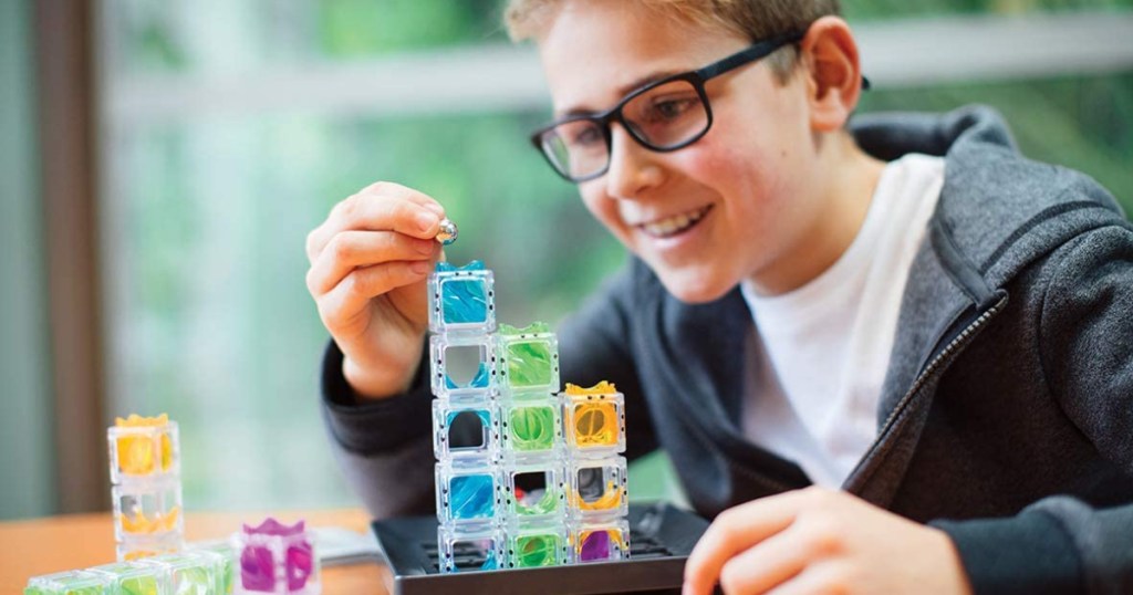 Boy playing ThinkFun game