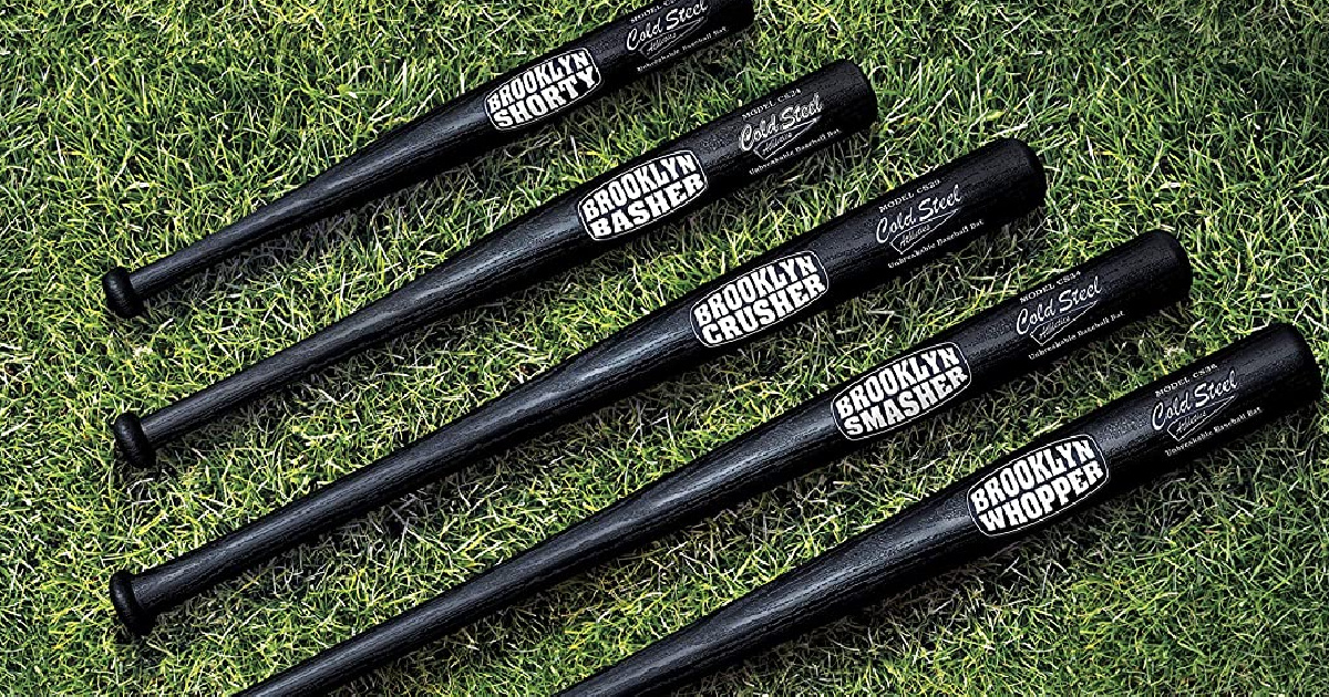 five Brooklyn Crusher Cold Steel baseball Bats in a row on turf
