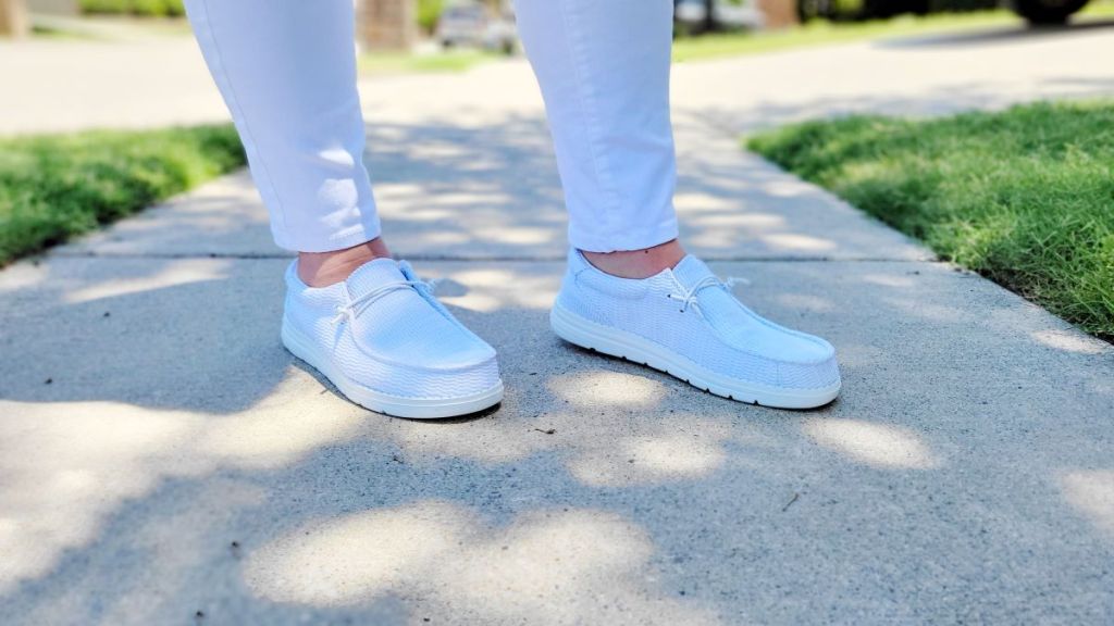 woman wearing a pair of white shoes