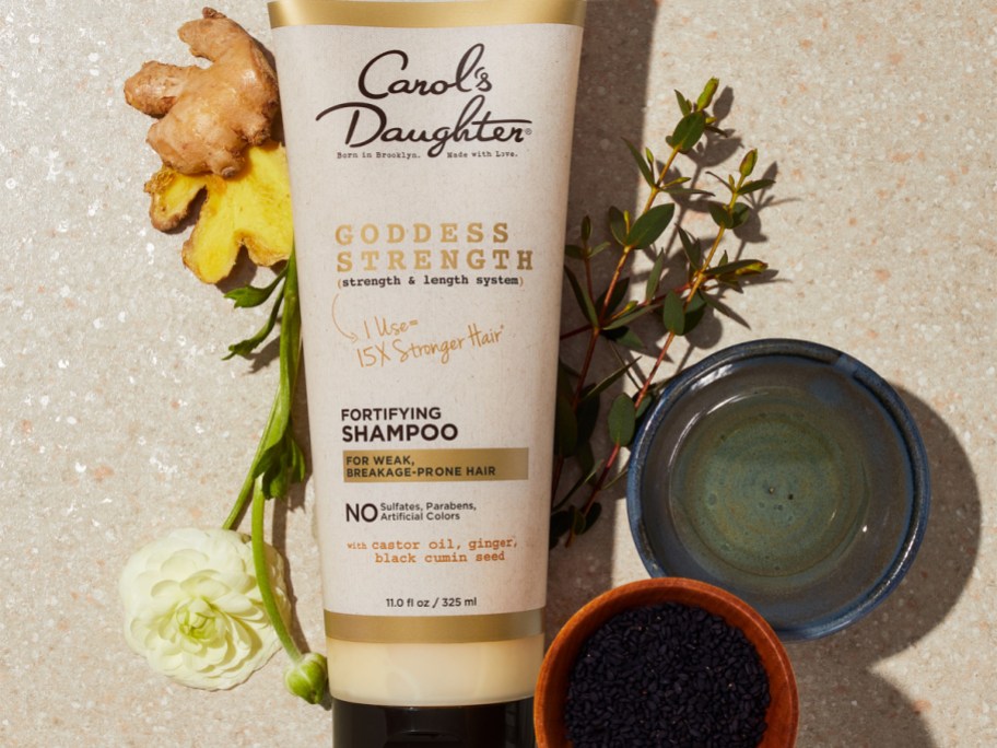 Carols Daughter goddess shampoo with ginger, flowers coffee and a syrup around it