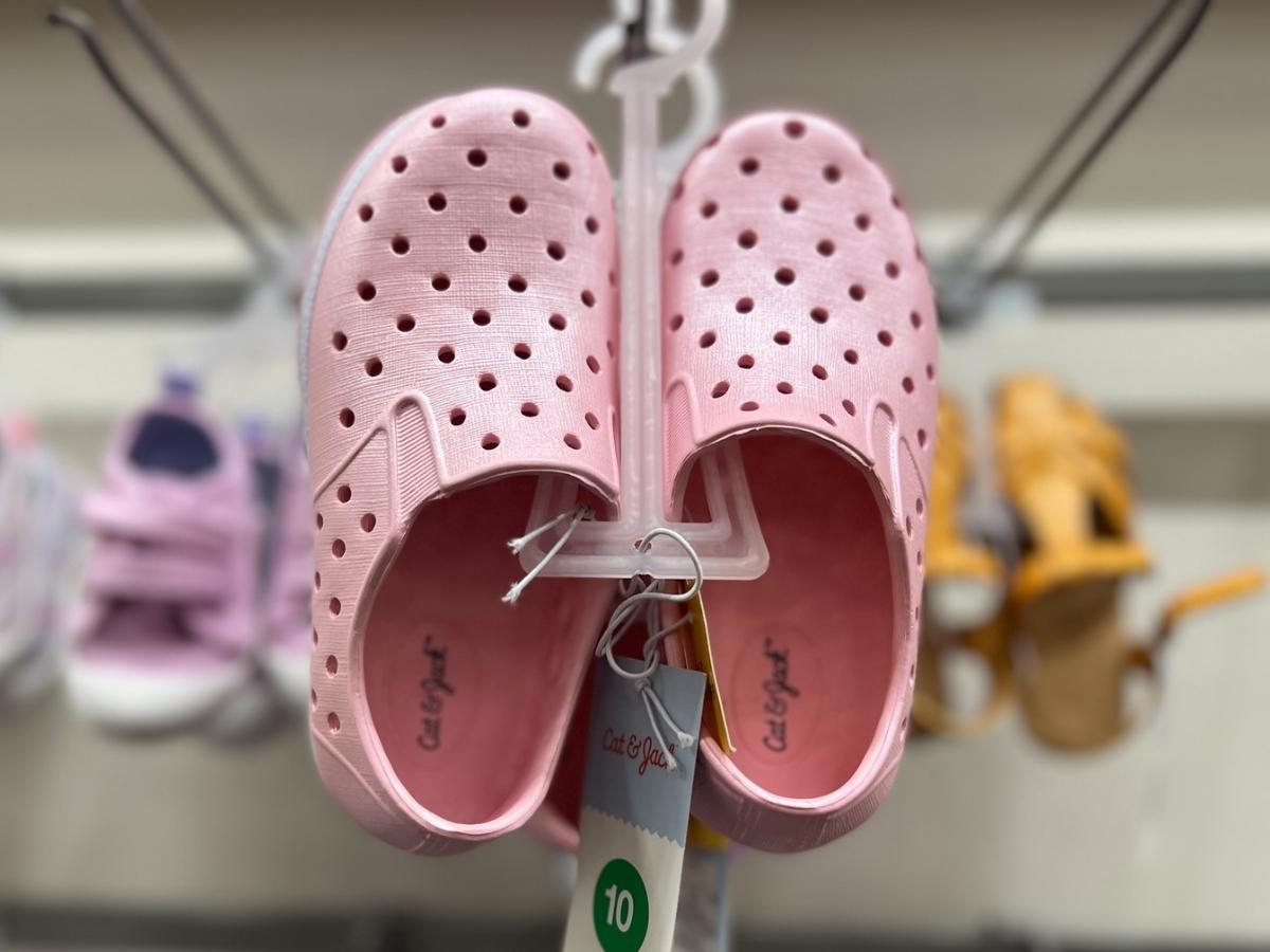 pair of pink Cat & Jack Toddler Jese Slip-On Apparel Water Shoes on a hanger at the store
