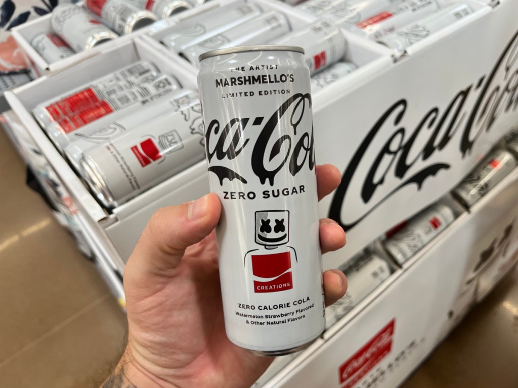 hand holding can of Coca-Cola x Marshmello Soda in store