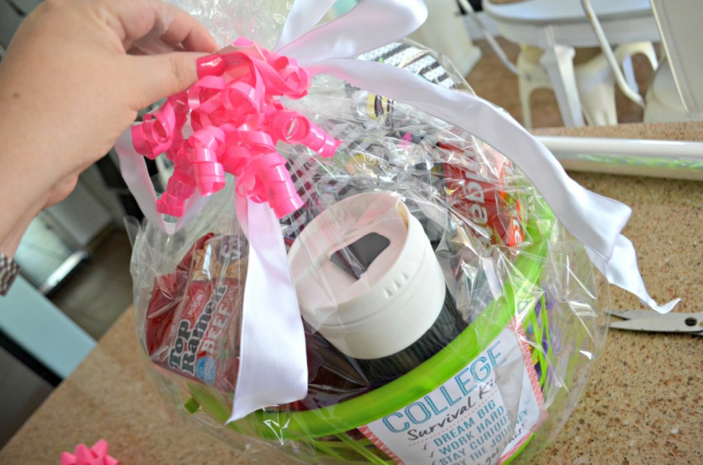 a college gift basket tied up with a ribbon