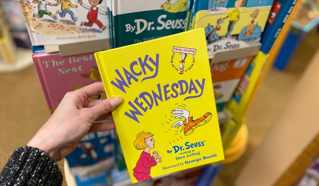 hand holding Dr. Seuss book in store