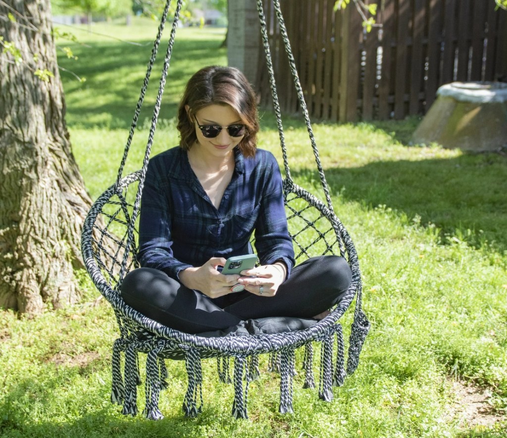 woman sitting on an Equip Hanging Hammock Chair