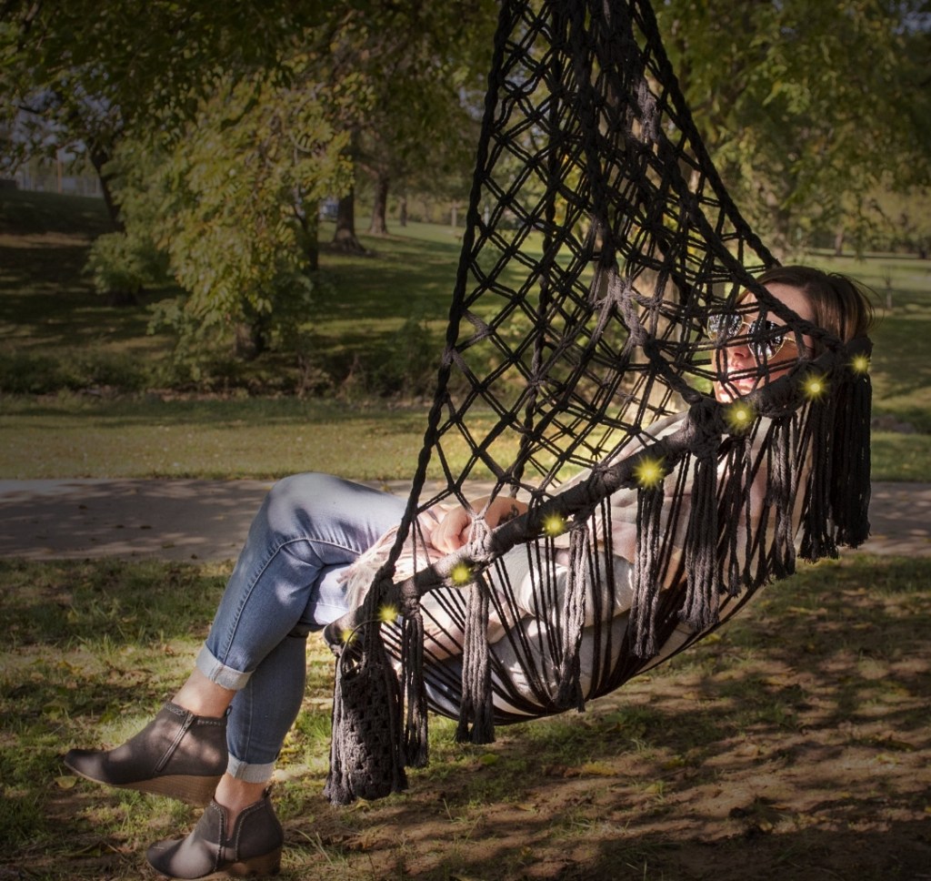 woman in a hanging hammock chair