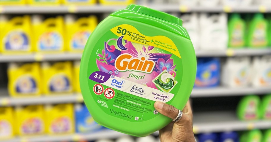hand holding up container of gain flings