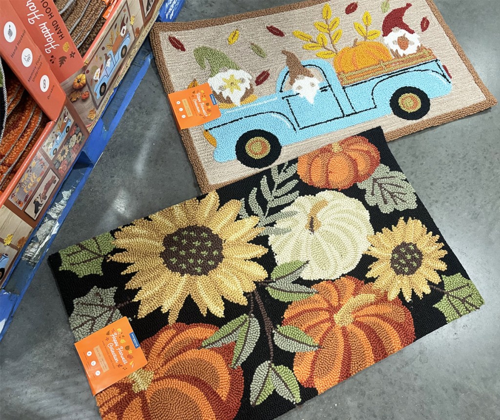 two fall accent rugs on ground