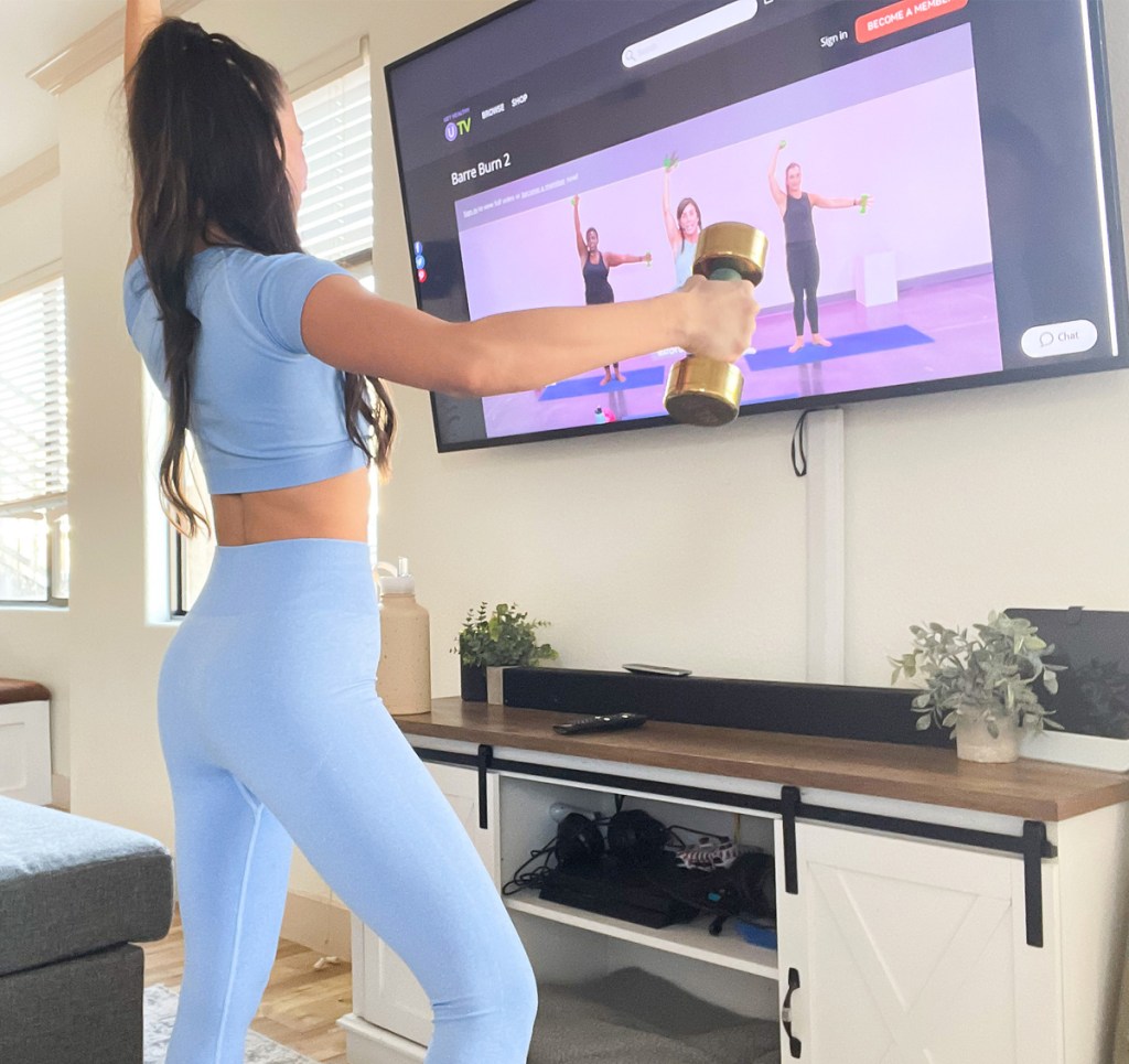 woman working out in front of tv