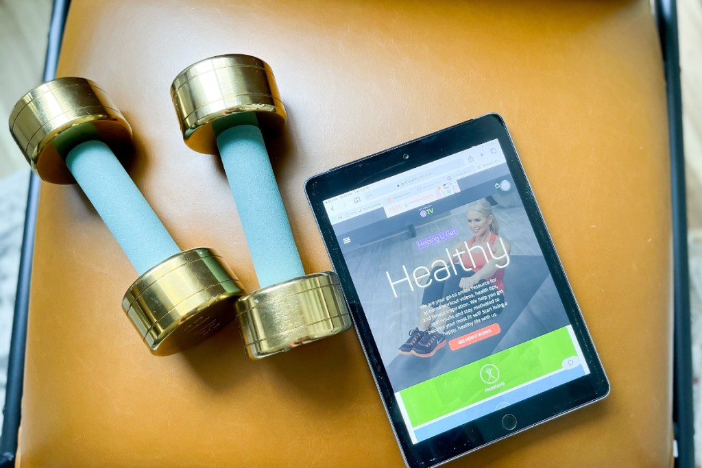 Get Healthy on tablet next to weights