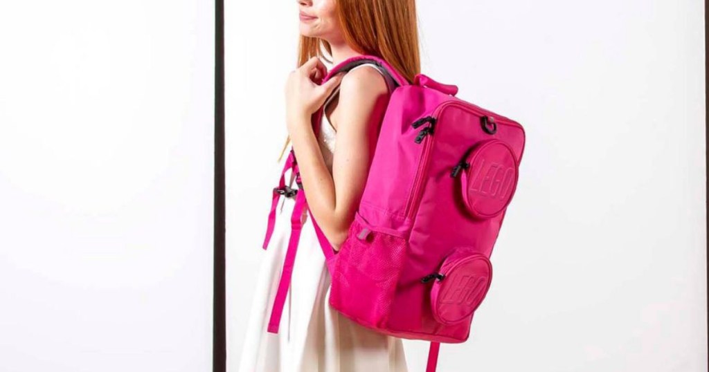 Girl wearing pink Lego Backpack