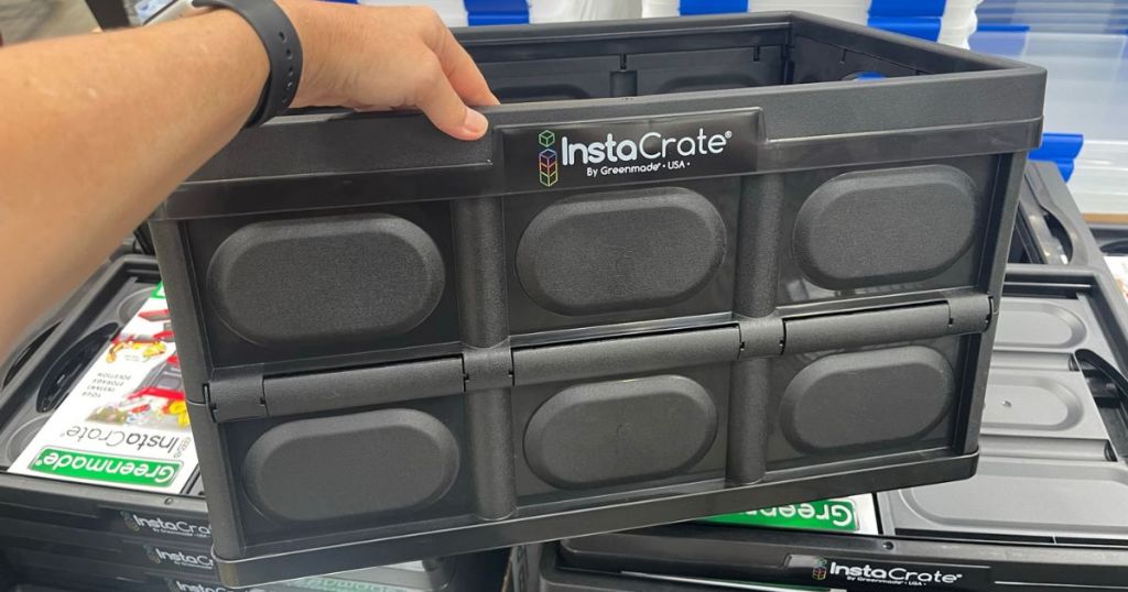 InstaCrate shown in store with person's hand on it