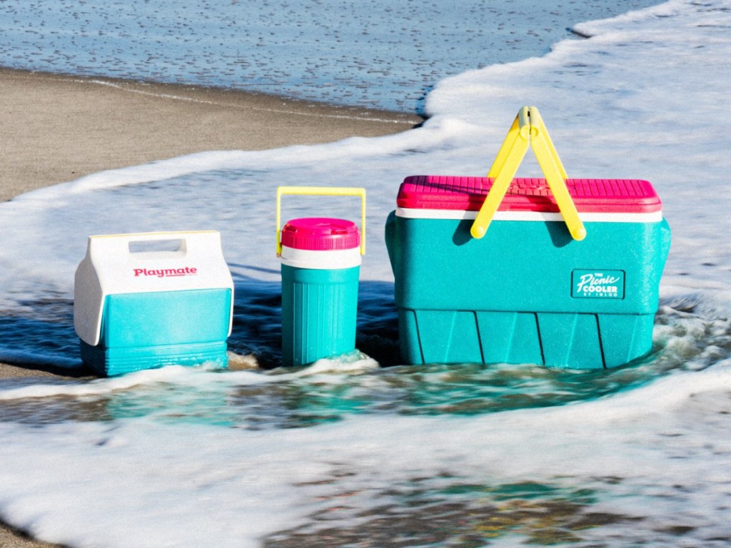 green and pink Igloo retro collection coolers on beach