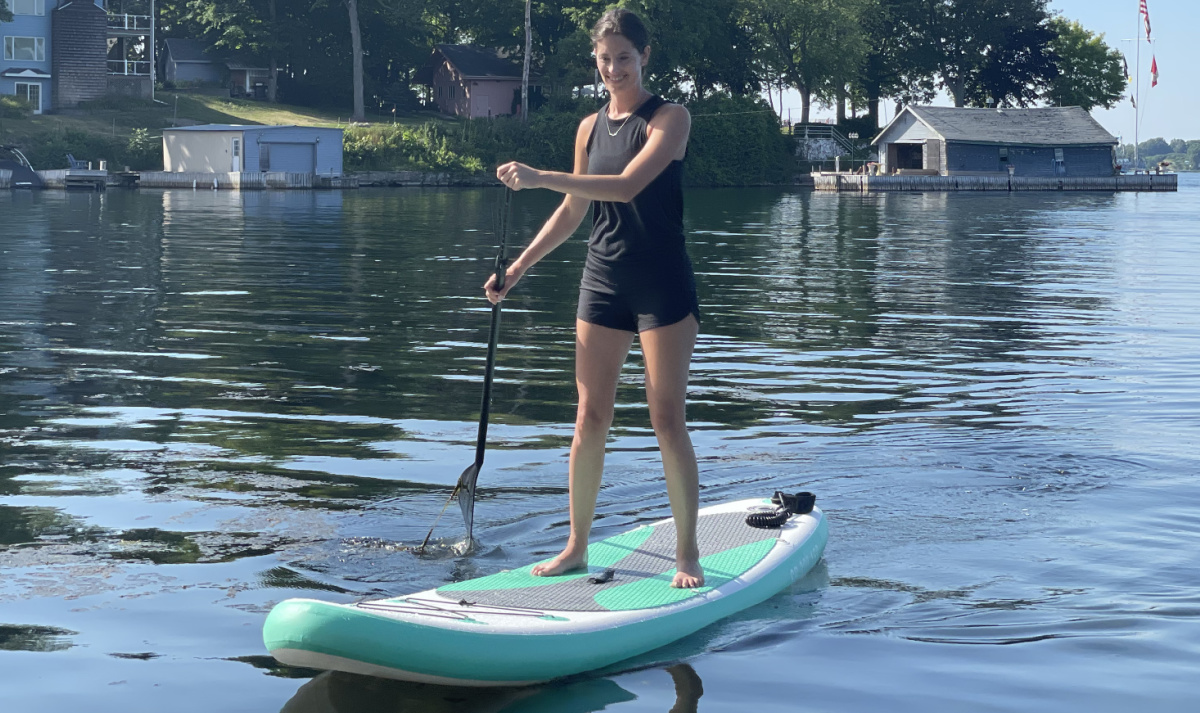 Woman on water standing on Jiubenju Inflatable Stand-Up Paddle Board