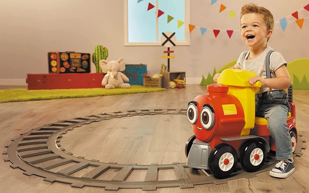 Little Tikes Cozy Train Scoot Ride-On Toy being ridden by boy on a Track 