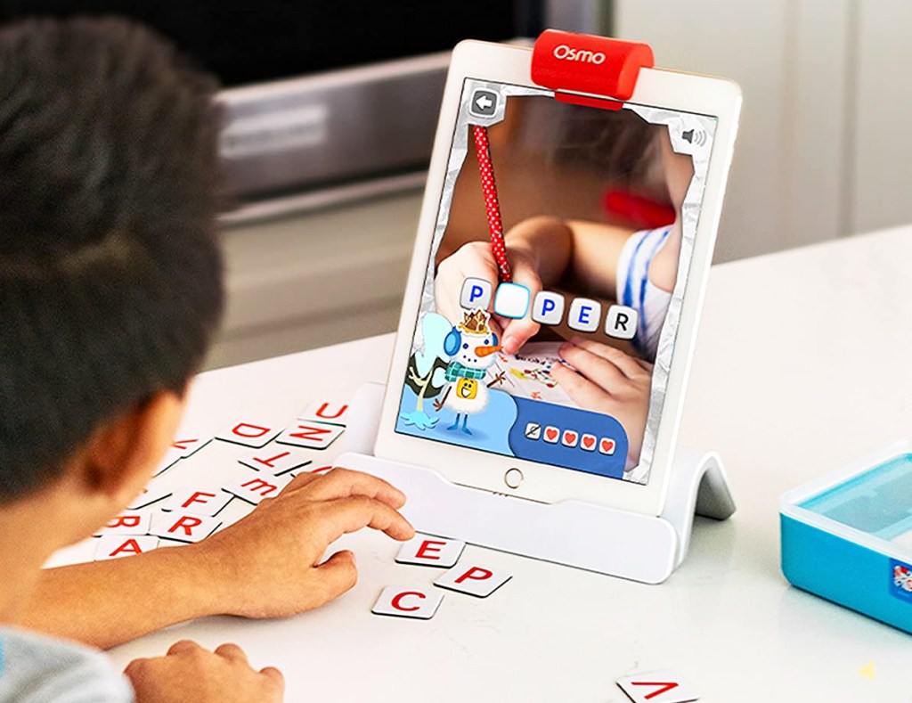 boy playing with Osmo Genius Words Game