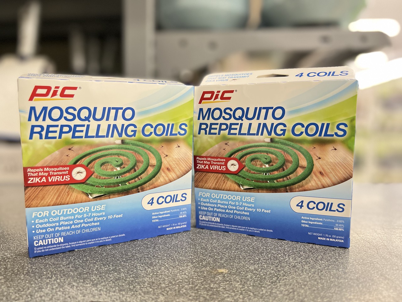 two boxes of Pic Mosquito Repellent Coils displayed side by side on counter