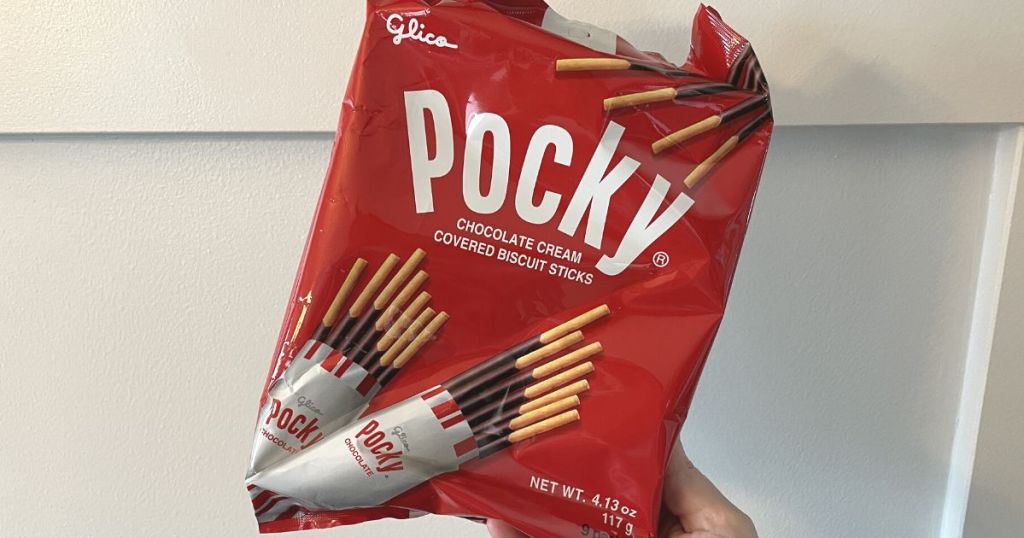 hand holding a bag of Pocky sticks
