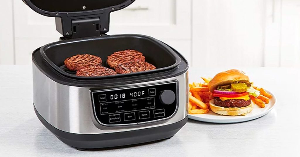 PowerXL air fryer system on counter with burger