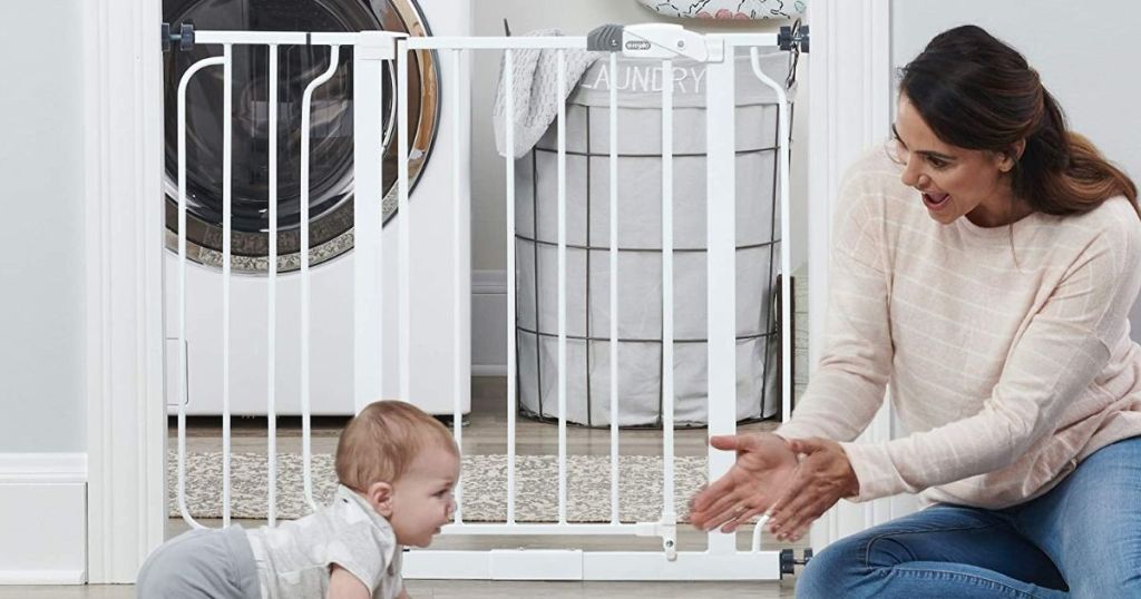 woman and baby by a gate