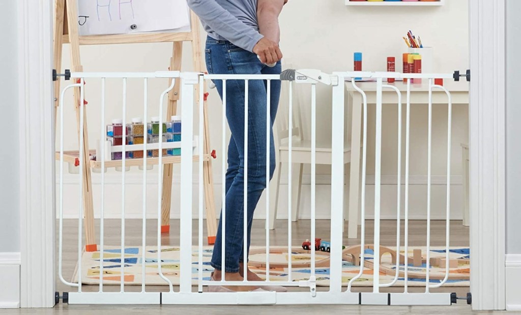 woman opening a baby gate