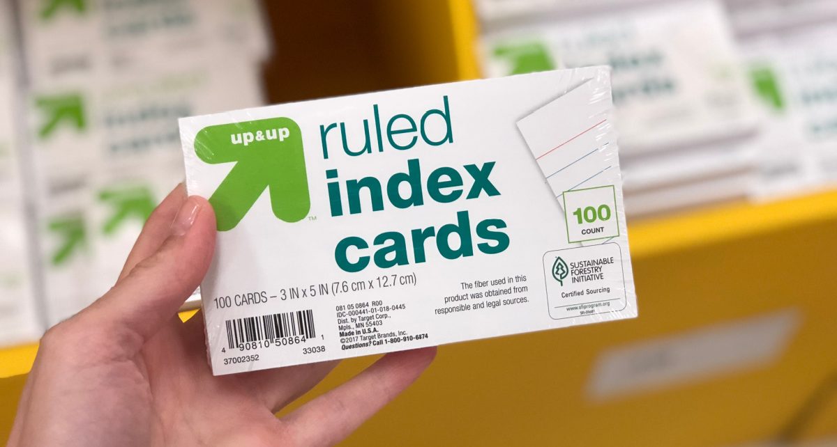 Hand holding up Index cards in the Target school supplies aisle