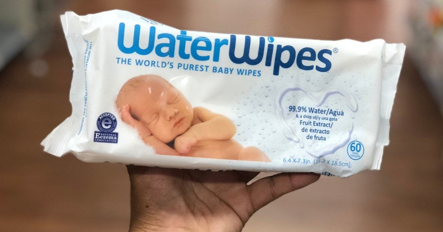 hand holding pack of waterwipes