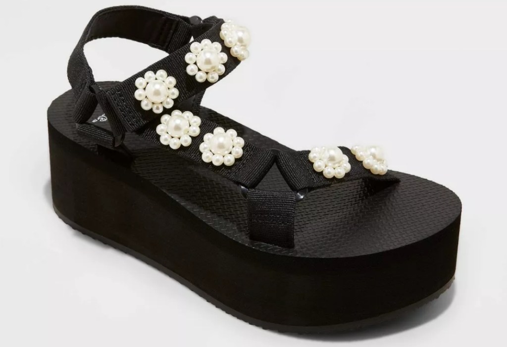Black platform sandal with flower beads on the straps