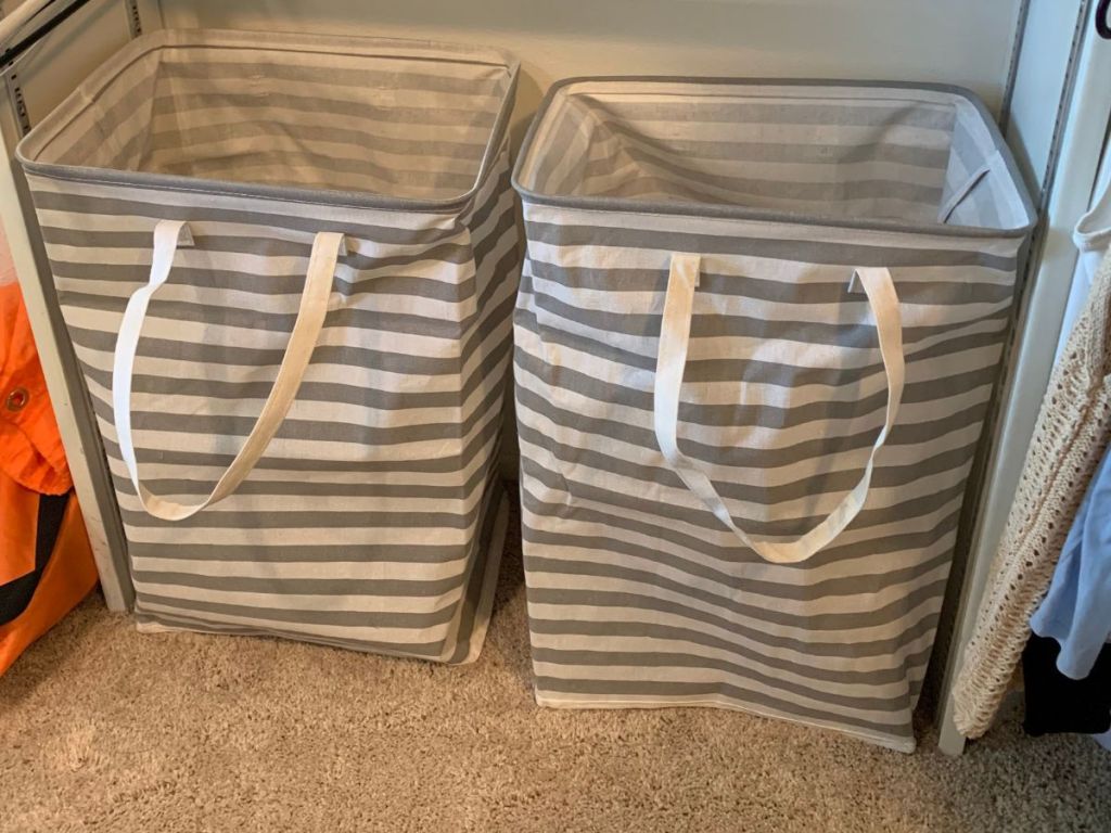 Two grey and white striped hampers