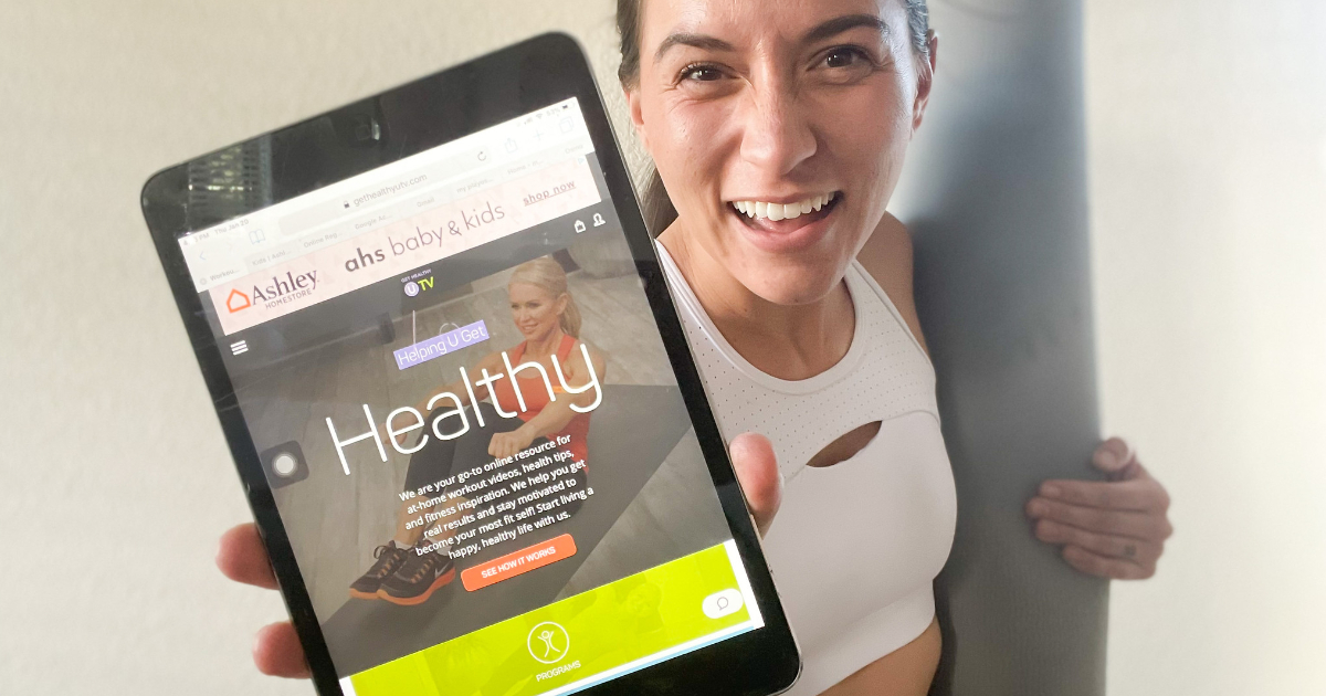Woman holding tablet with Get Healthy U TV