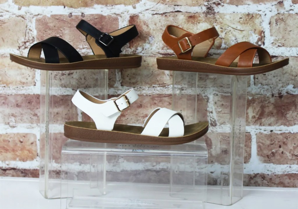 three pairs of sandals on display