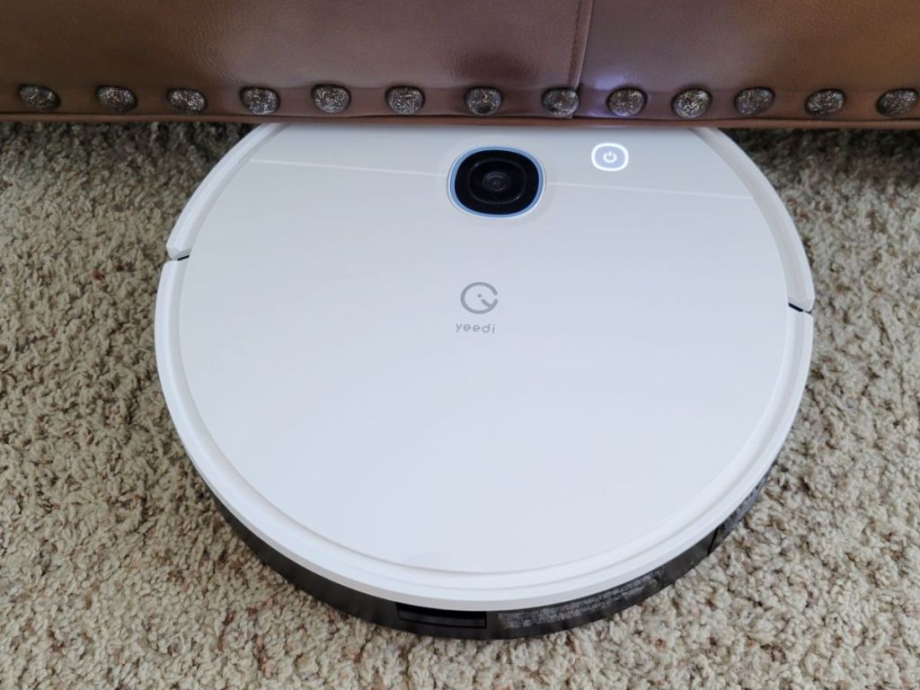 Yeedi Robot Vacuum sliding underneath a couch to clean