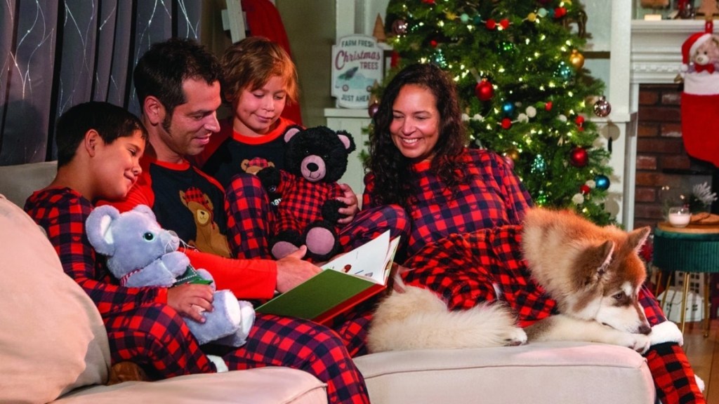 family wearing buffalo check pajamas at Christmas
