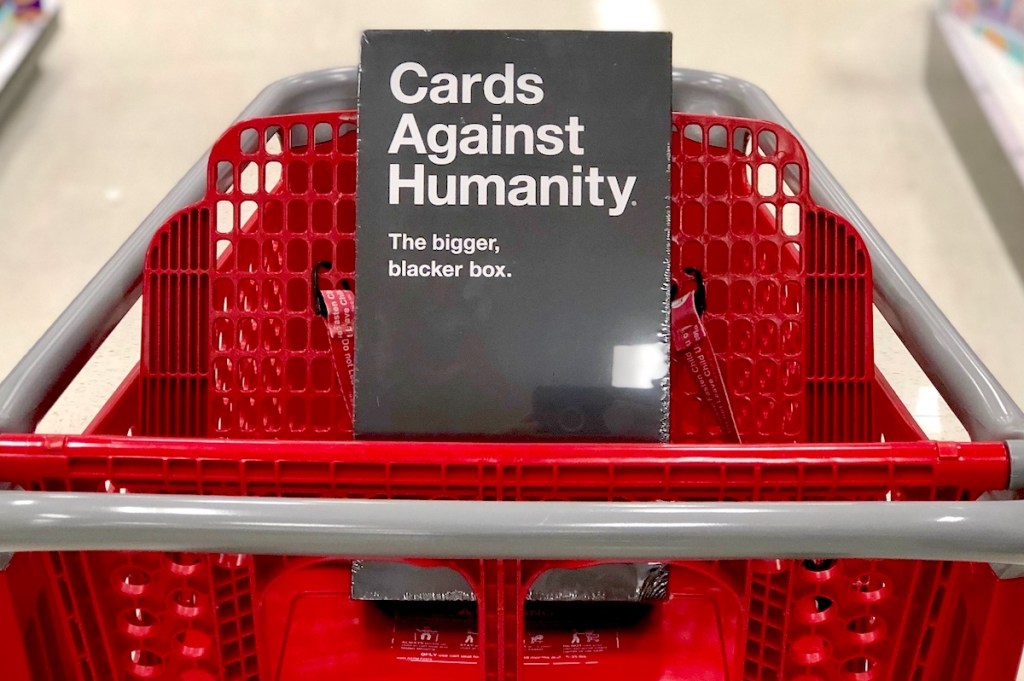 cards against humanity game sitting in red target cart in store