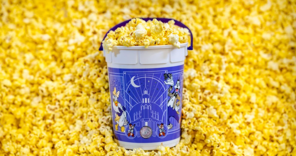 disney popcorn bucket in pile of popcorn