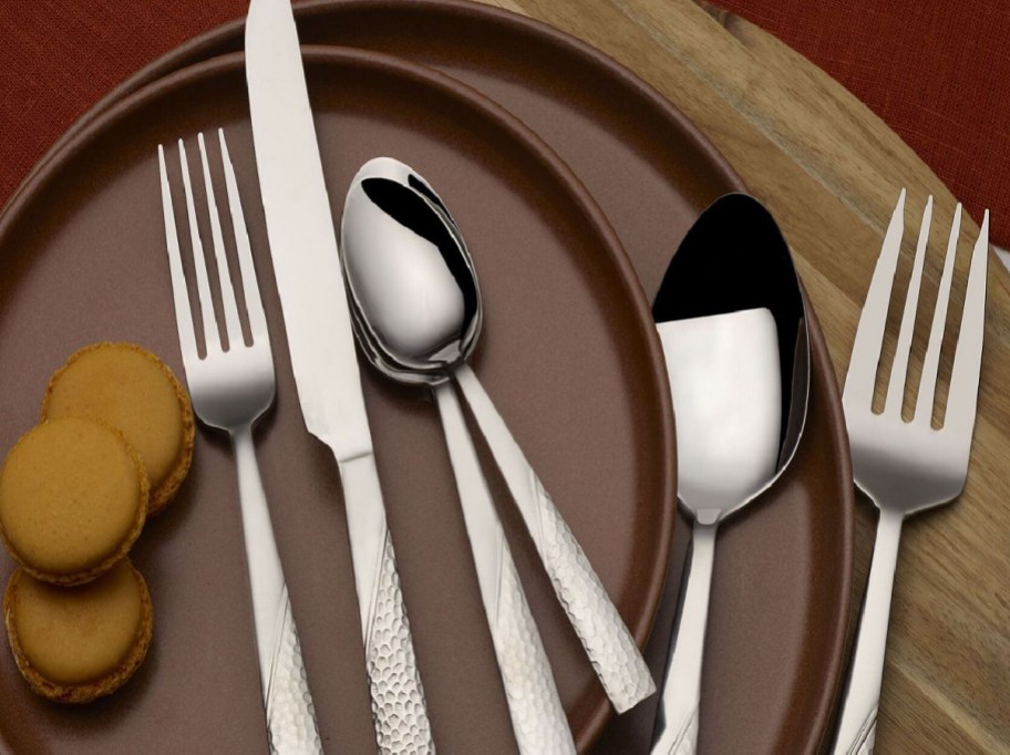 flatware on top of plates and cookies
