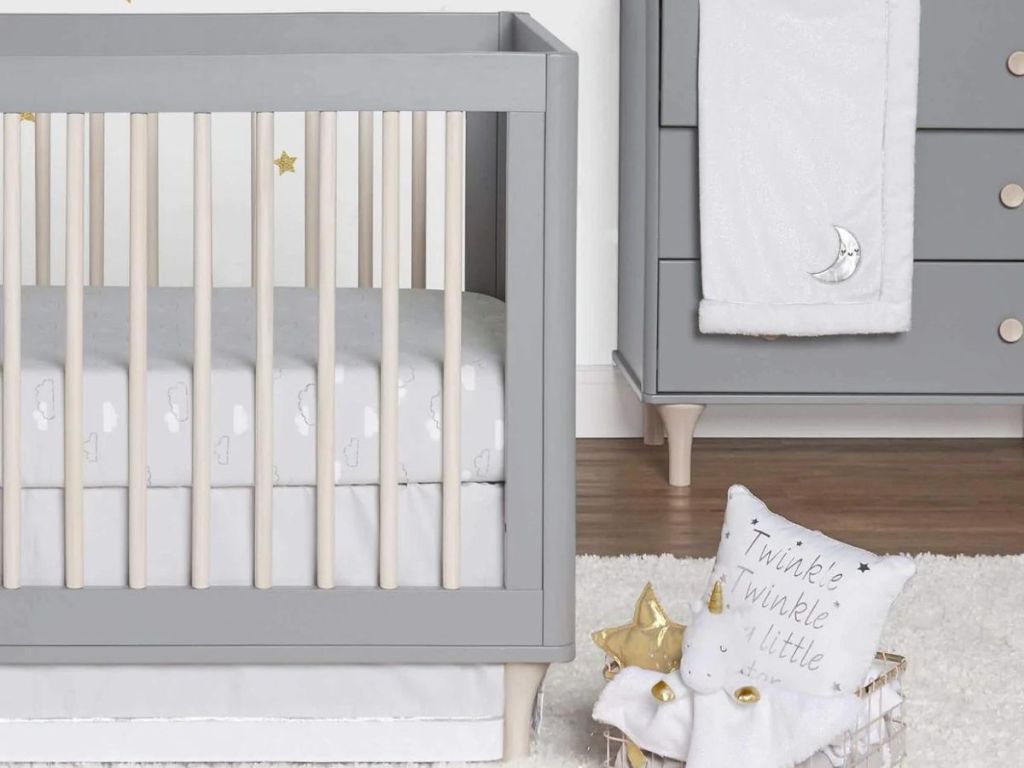 baby crib and sheets and blankets