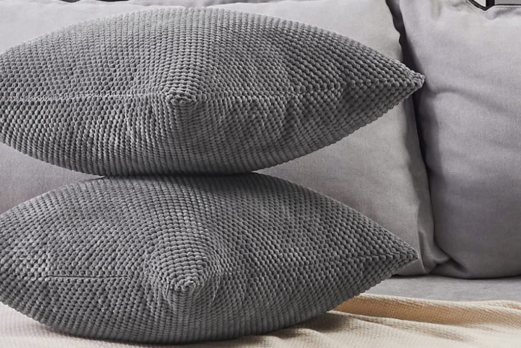 two gray pillows stacked