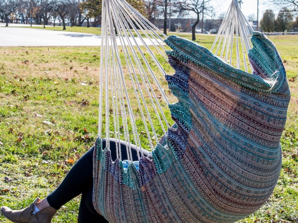 back of multicolored fabric seat with person sitting in it