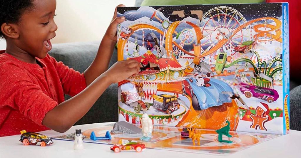 boy playing with 2022 Hot Wheels Advent Calendar Playset