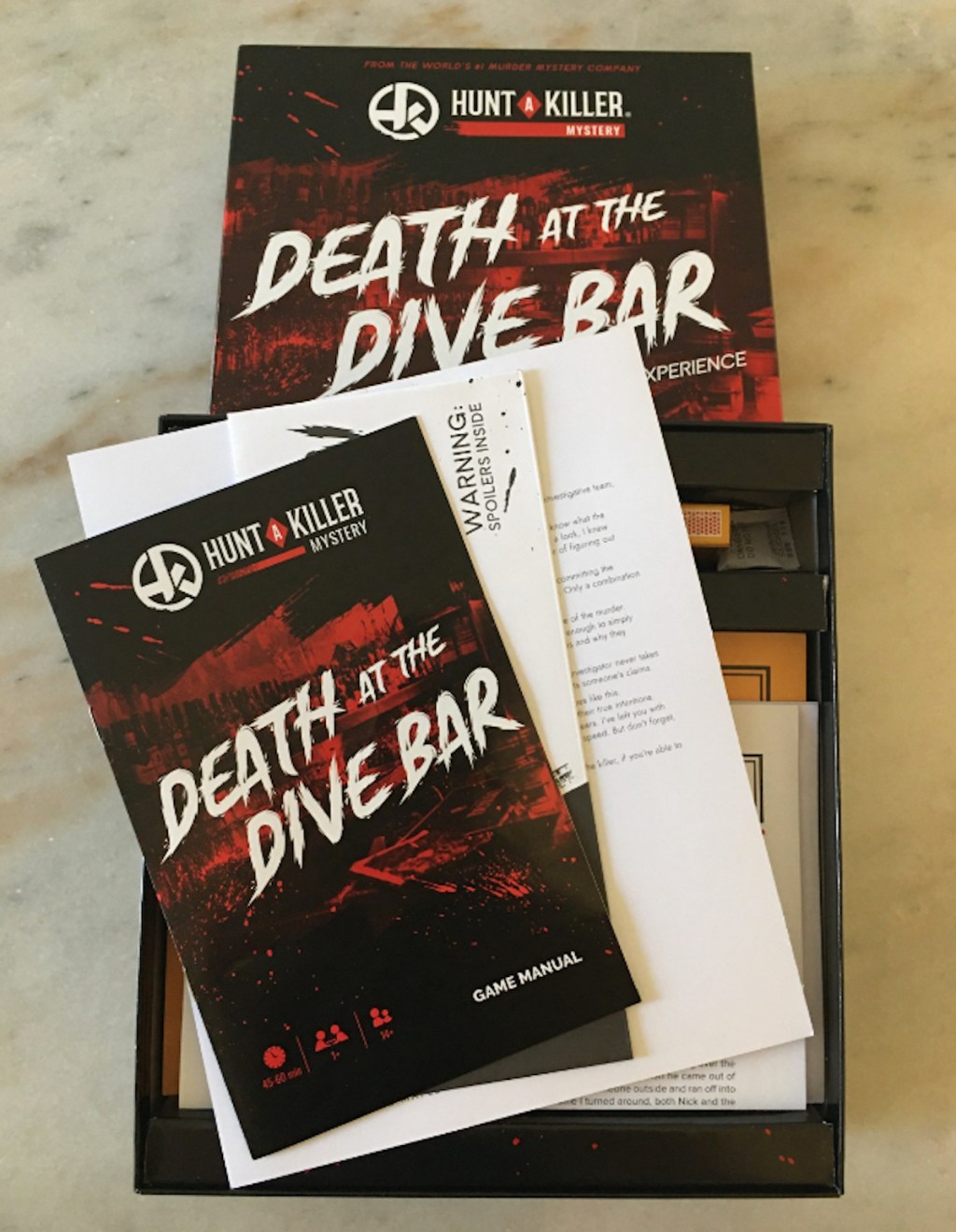 hunt a killer death at the dive bar board game for adults on table