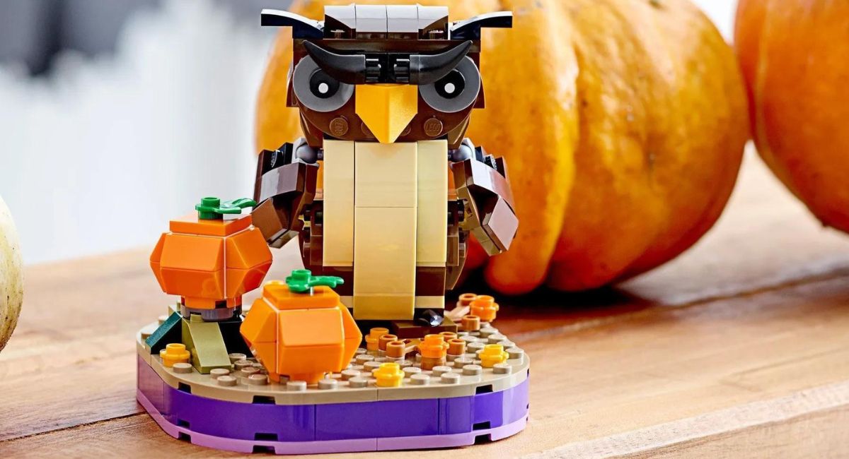 assembled LEGO Halloween Owl sitting in front of pumpkins on a table
