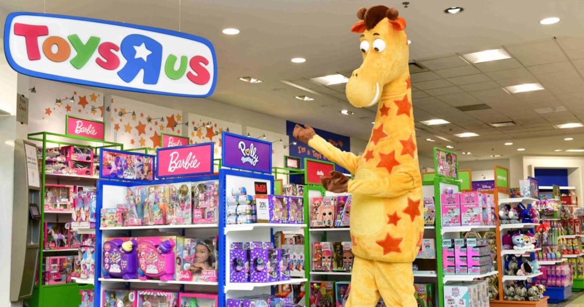 large plush giraffe inside toy store