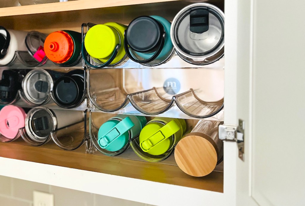 close up of clear bottle organizers in cabinet