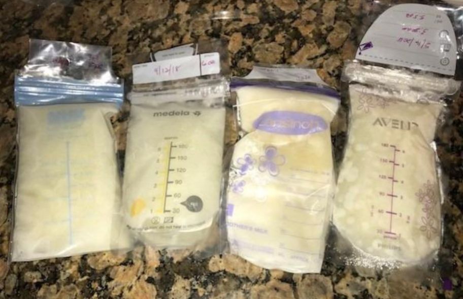 4 bags of breast milk on a granite counter top