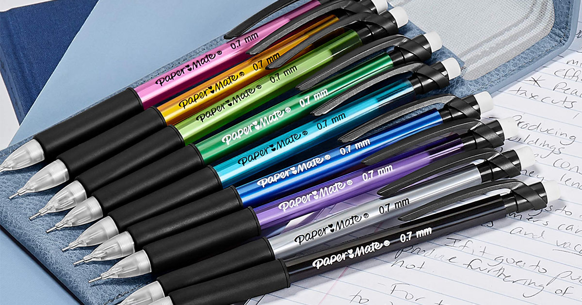 multi colored paper mate mechanical pencils laying together on notebook