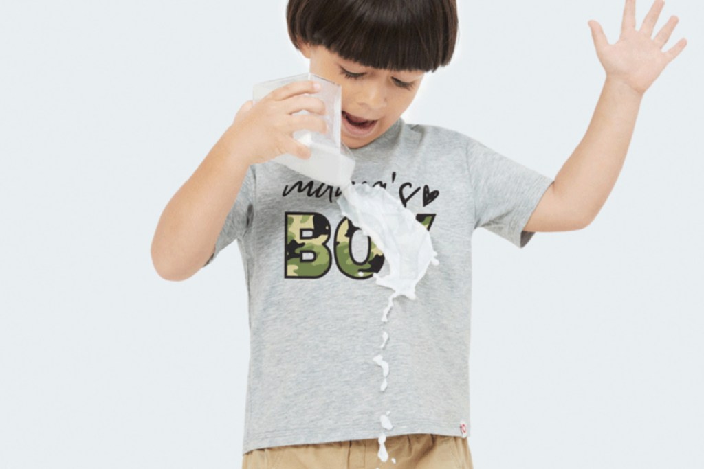 kid spilling on graphic shirt